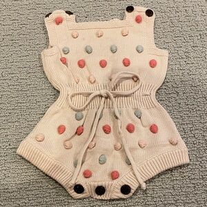 Baby or toddler sized 3-6M Cute Knit Baby Romper with colorful Pom Poms & tie